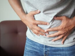 young man suffering from bloating