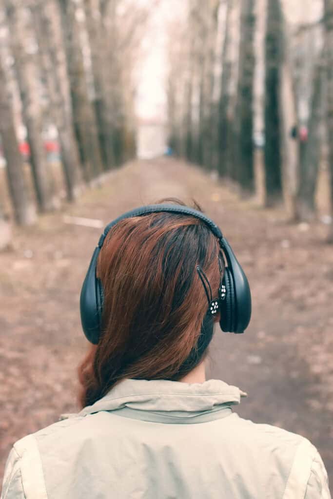 a woman walking while listening to music