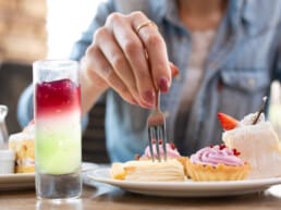 Woman eating sweets at a restaurant