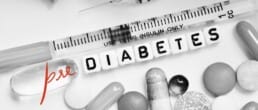 pills and syringe with Prediabetes written across them