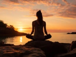 Woman meditating at a lakefront