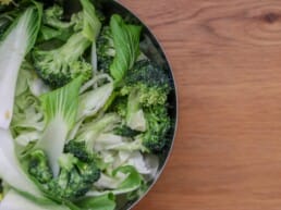 bowl with brassicas: broccoli and pak choi