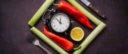 Intermittent fasting clock on chopping board